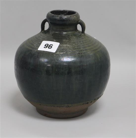 A Chinese Henan type black and green glazed jar, Song-Yuan dynasty H.18cm.